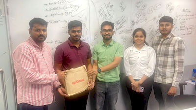 upGrad Ahmedabad office - student and parents with the counselling team after their study abroad session